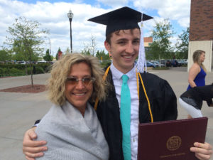 Tyler and his mother celebrating his graduation.
